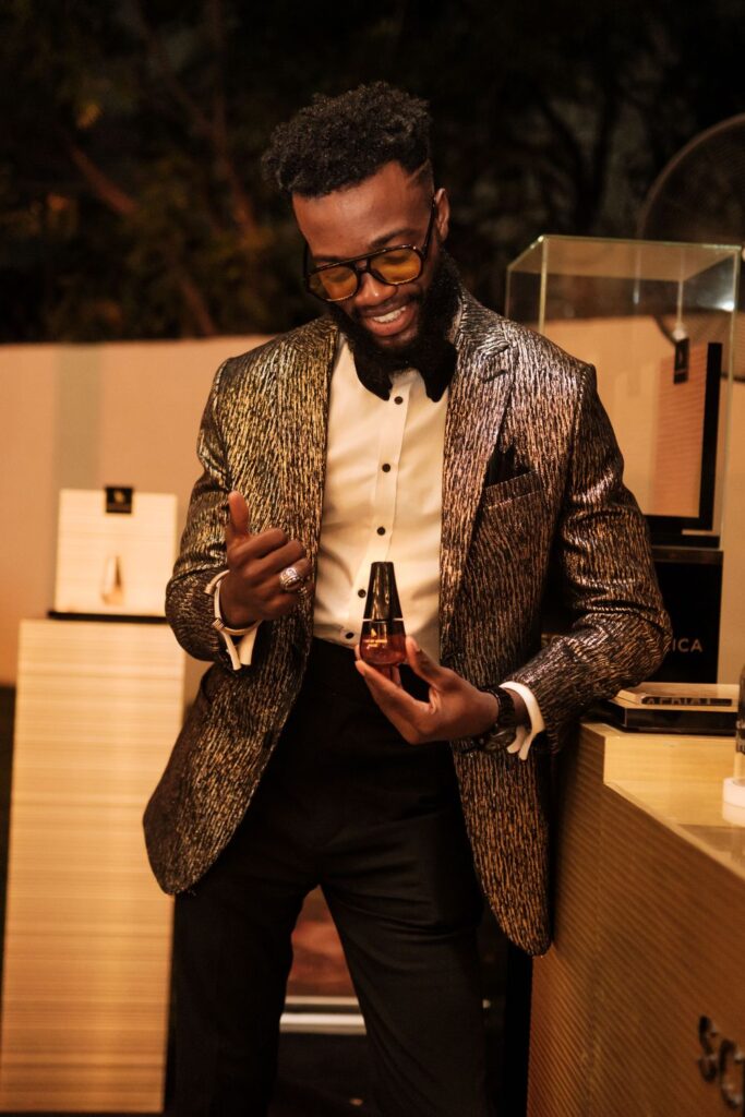Man holding a perfume bottle